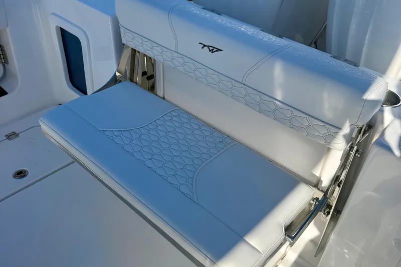 Slide: The Image of 2026 Tidewater 282 CC Adventure boat seat with stylish white upholstery and hexagonal pattern. - 63