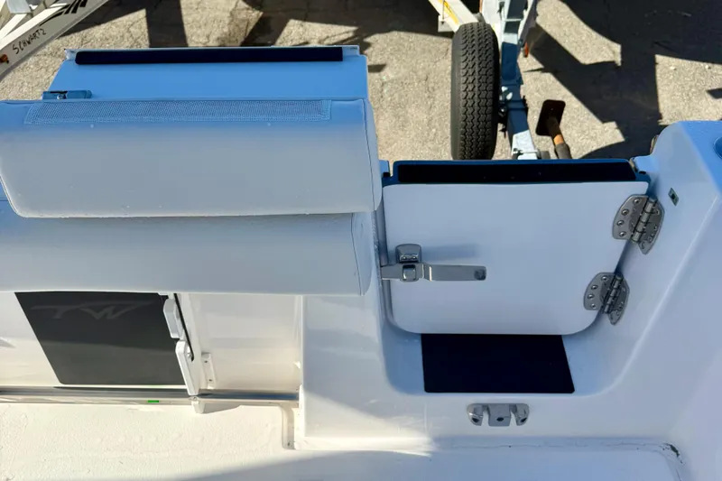 Slide: The Image of 2026 Tidewater 282 CC Adventure boat with open hatch and seating detail. - 64