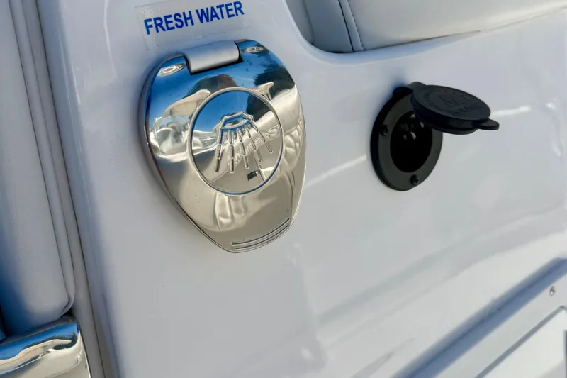 Slide: The Image of 2026 Tidewater 282 CC Adventure boat's fresh water access point and plug detail. - 66