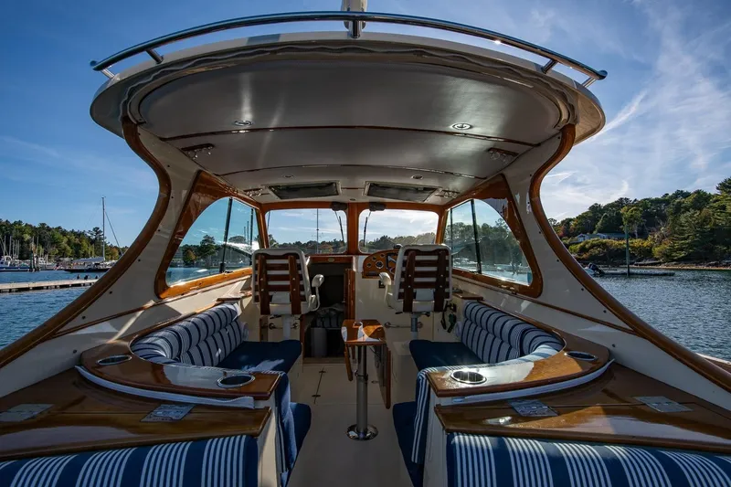 Slide: The Image of Interior view of 2013 Hinckley Talaria 34 yacht with elegant seating and wood finishes. - 13