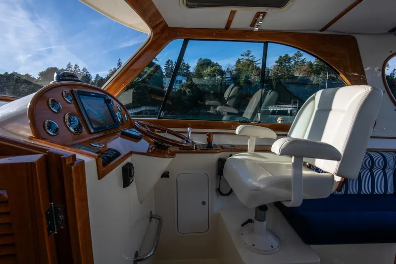 Slide: The Image of Interior of 2013 Hinckley Talaria 34 yacht with luxurious helm and seating. - 16