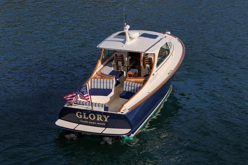 Slide: The Image of 2013 Hinckley Talaria 34 boat named "Glory" on water, rear view. - 26