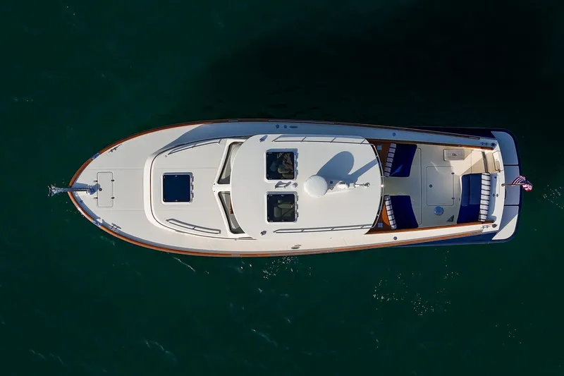 Slide: The Image of Overhead view of 2013 Hinckley Talaria 34 yacht on calm water. - 27