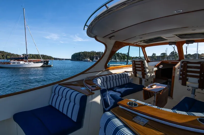 Slide: The Image of Interior view of 2013 Hinckley Talaria 34 yacht with scenic harbor backdrop. - 14