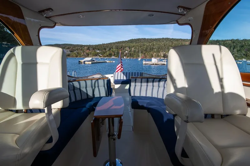 Slide: The Image of Interior of 2013 Hinckley Talaria 34 yacht with scenic lake view and comfortable seating. - 17