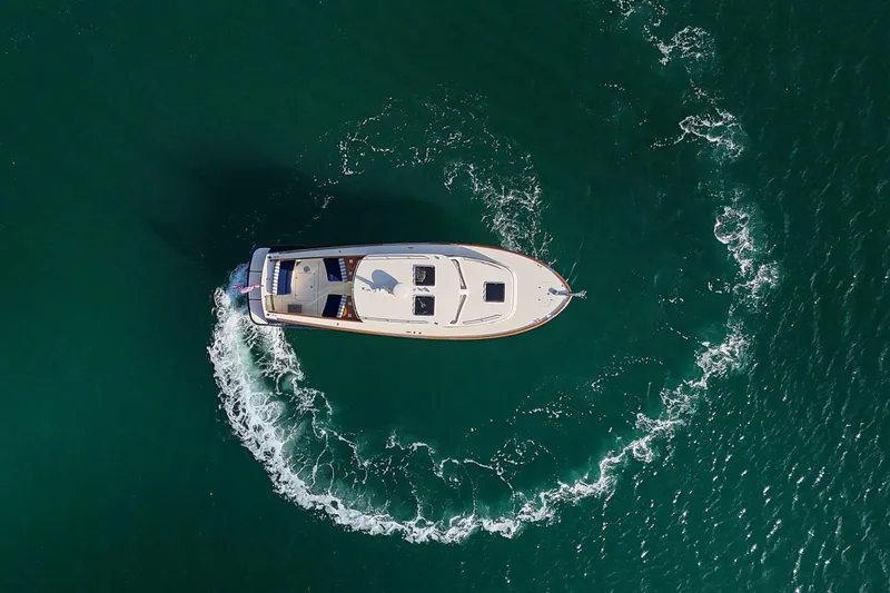 Slide: The Image of Aerial view of 2013 Hinckley Talaria 34 yacht cruising in clear waters. - 28