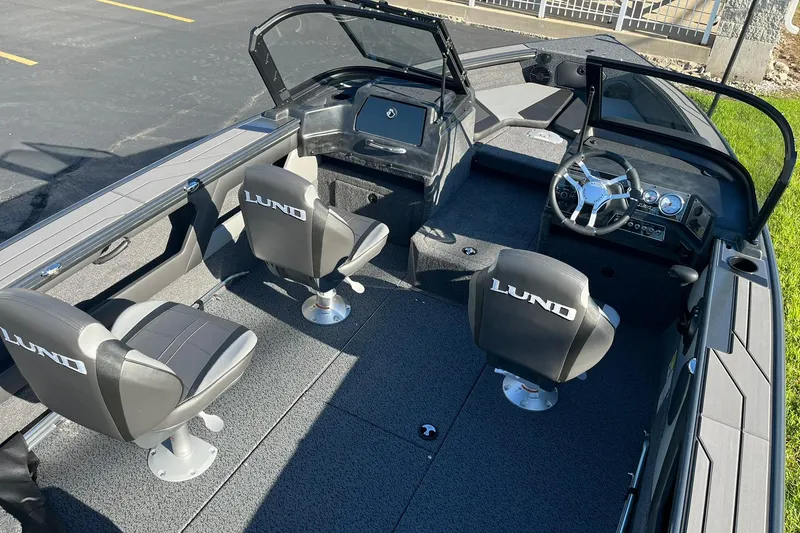 Slide: The Image of 2026 Lund 1875 Crossover XS boat on trailer outside Water Werks Boat Sales. - 2