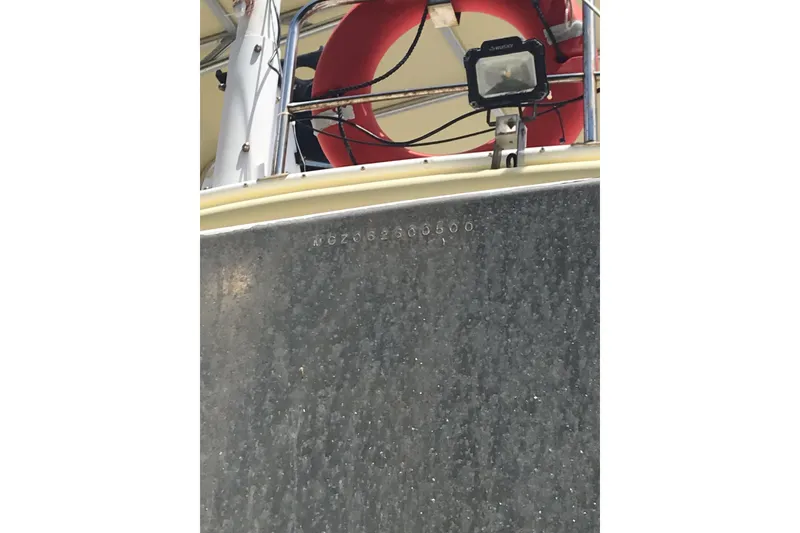 Slide: The Image of Custom 1999 Sport Fishing boat with life preserver and spotlight on deck. - 14