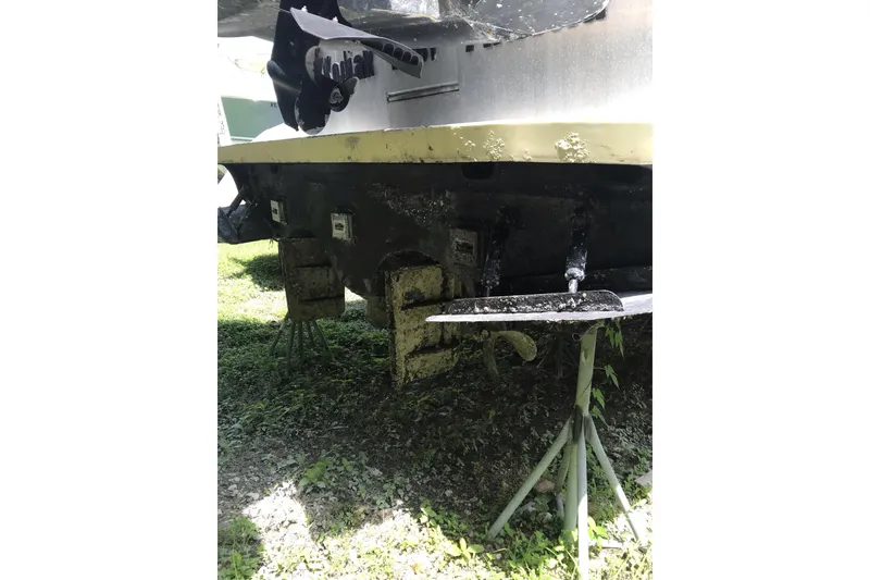 Slide: The Image of 1999 Custom Sport Fishing boat hull on stands, showing propeller and rudder. - 2