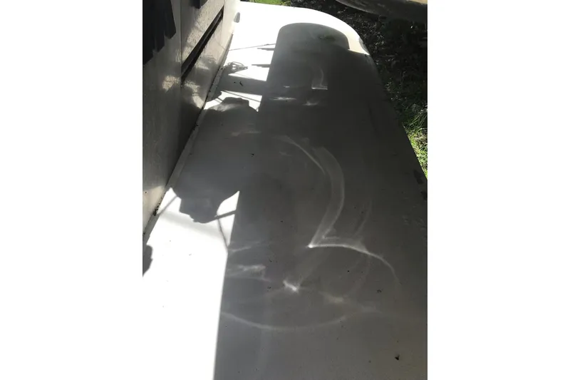 Slide: The Image of Shadow of a 1999 Custom Sport Fishing boat on a sunny day. - 36