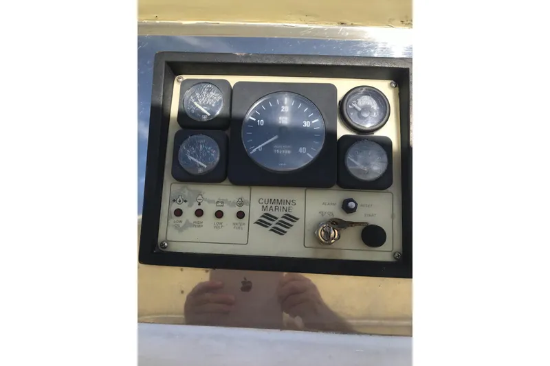 Slide: The Image of Instrument panel of a 1999 Custom Sport Fishing boat with Cummins Marine gauges. - 38