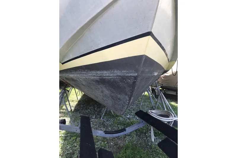 Slide: The Image of 1999 Custom Sport Fishing boat hull on trailer, outdoor setting. - 5