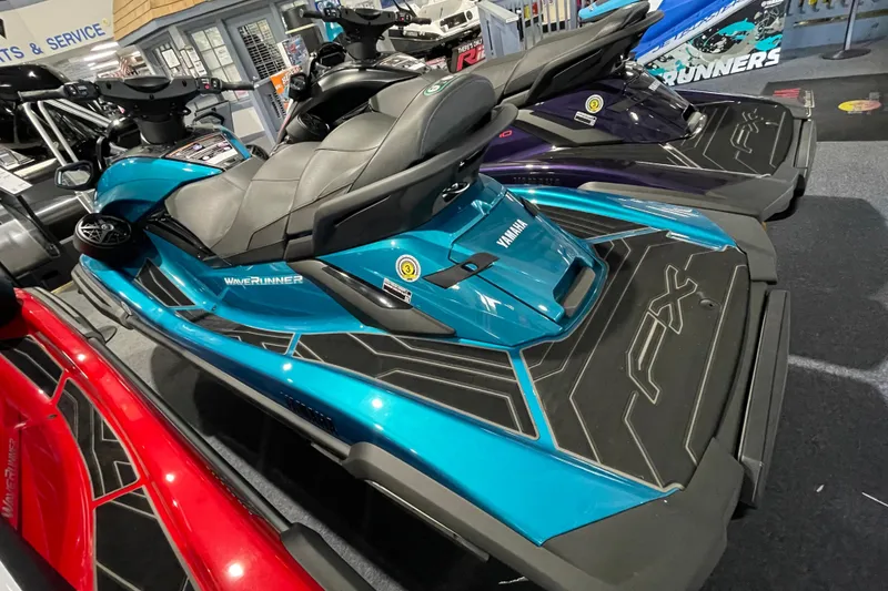 Slide: The Image of 2026 Yamaha WaveRunner FX Cruiser SVHO in showroom, featuring sleek design and vibrant colors. - 16