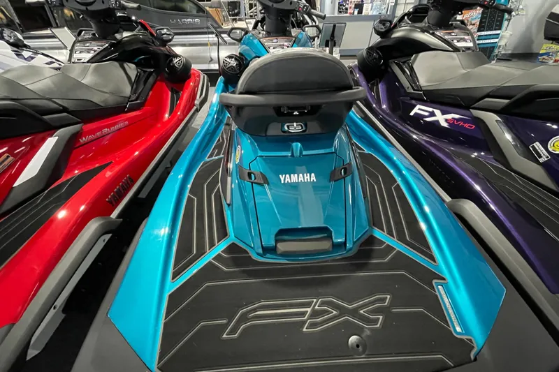Slide: The Image of 2026 Yamaha WaveRunner FX Cruiser SVHO in showroom, vibrant blue color, sleek design. - 5
