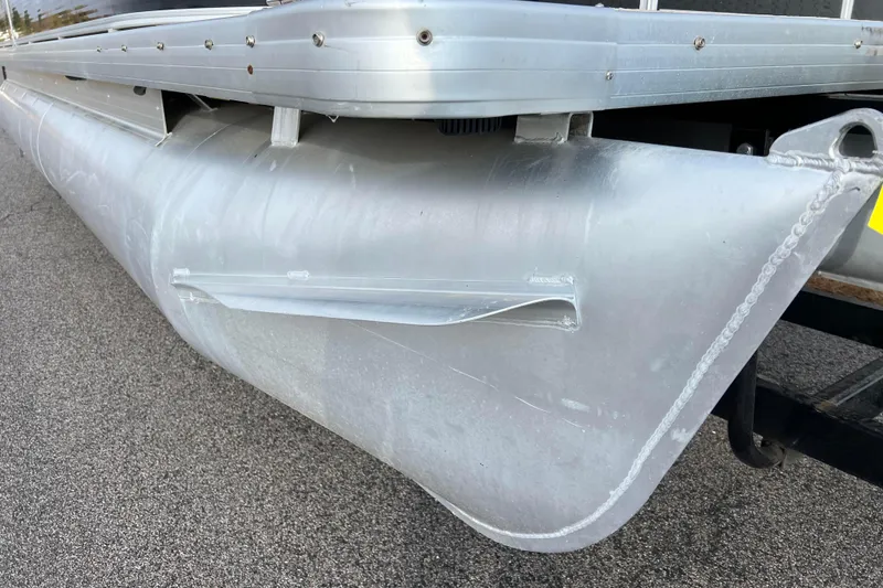 Slide: The Image of Close-up of 2013 Godfrey Sweetwater 2286 pontoon boat's aluminum hull on pavement. - 14