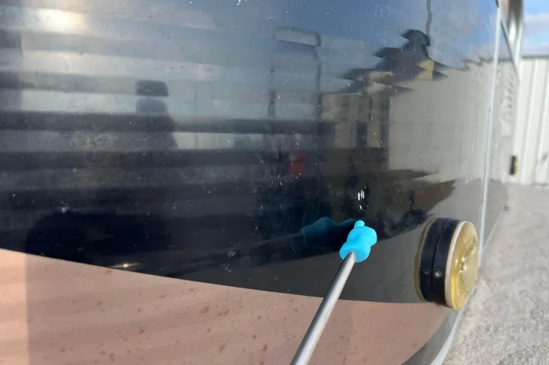 Slide: The Image of Reflection on Godfrey Sweetwater 2286 boat surface, 2013 model, with blue tool pointing. - 15