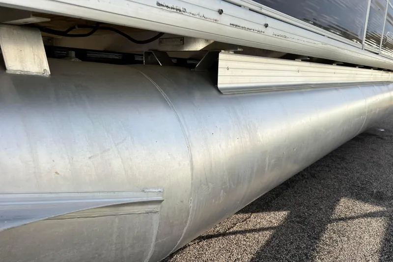 Slide: The Image of Close-up of 2013 Godfrey Sweetwater 2286 pontoon boat's aluminum hull on pavement. - 20