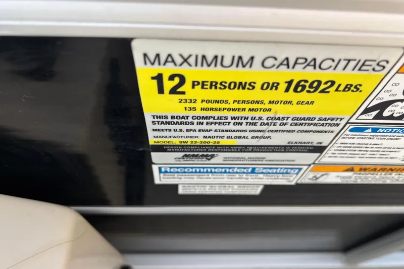 Slide: The Image of 2013 Godfrey Sweetwater 2286 capacity label: 12 persons or 1692 lbs, 135 horsepower motor. - 29