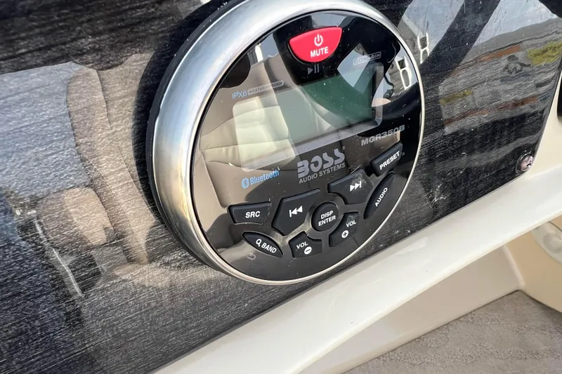 Slide: The Image of Close-up of Boss Audio Systems control panel on 2013 Godfrey Sweetwater 2286 boat. - 33