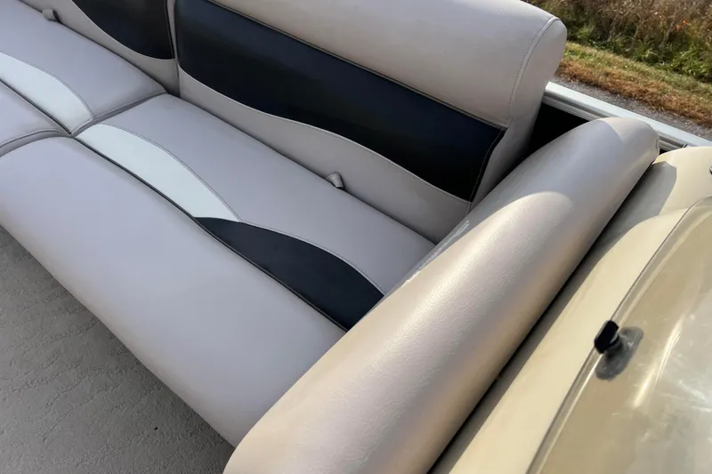 Slide: The Image of 2013 Godfrey Sweetwater 2286 boat seat with beige and black upholstery. - 34