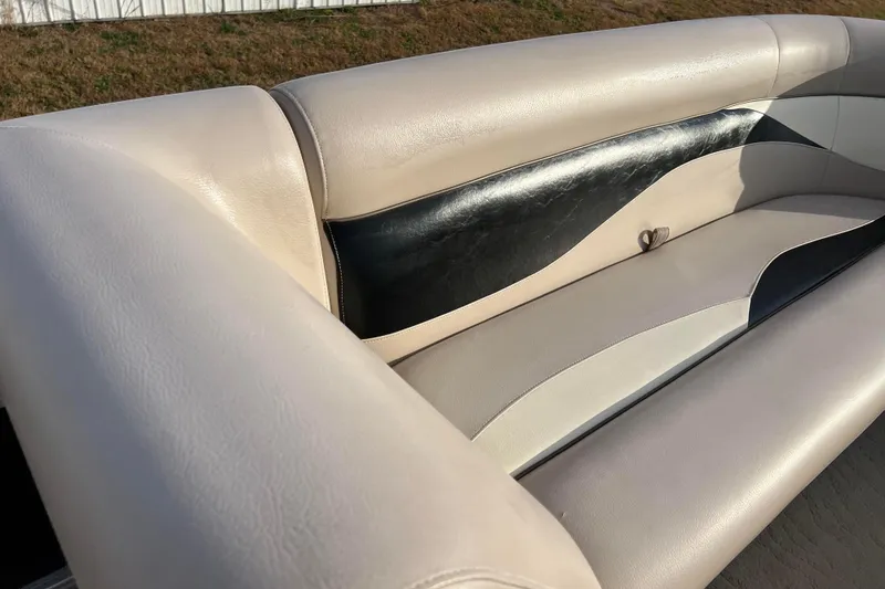 Slide: The Image of 2013 Godfrey Sweetwater 2286 boat seat with beige and black upholstery. - 42