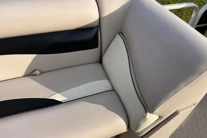 Slide: The Image of 2013 Godfrey Sweetwater 2286 boat seat with beige and black upholstery. - 45