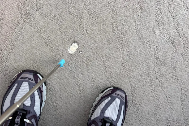 Slide: The Image of Person cleaning carpet on 2013 Godfrey Sweetwater 2286 boat with stick tool. - 50