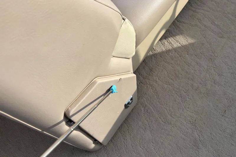 Slide: The Image of 2013 Godfrey Sweetwater 2286 boat interior with beige upholstery and carpeted flooring. - 51