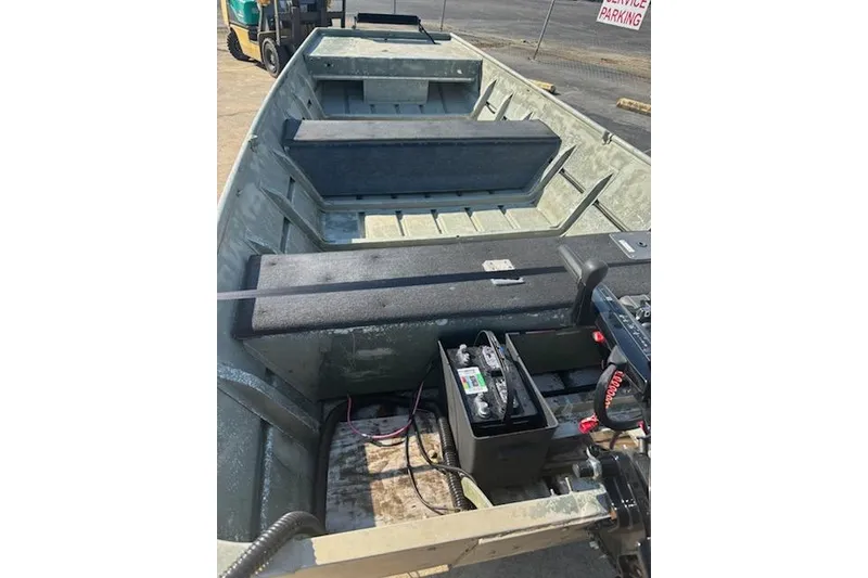 Slide: The Image of 1981 Lowe L1448 Jon boat interior with battery and seating. - 3