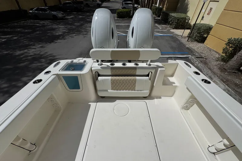 Slide: The Image of 2026 Bulls Bay 255CC boat interior with seating and storage compartments. - 10