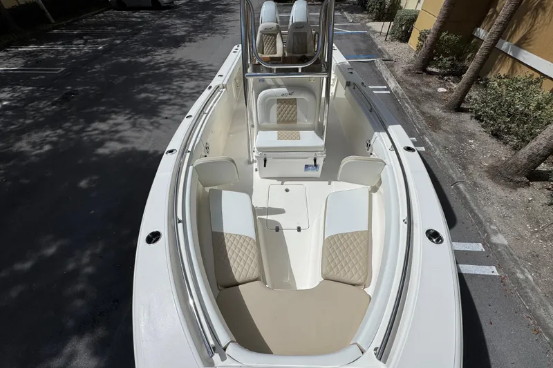 Slide: The Image of 2026 Bulls Bay 255CC boat interior with cushioned seating and sleek design. - 22