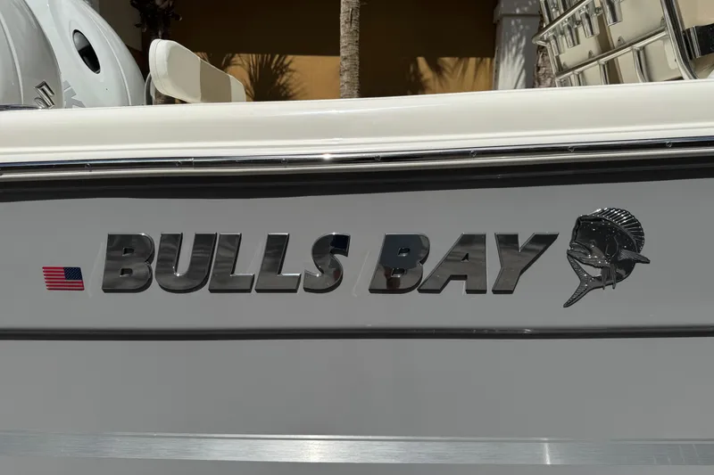 Slide: The Image of 2026 Bulls Bay 255CC boat logo with American flag and fish emblem. - 25
