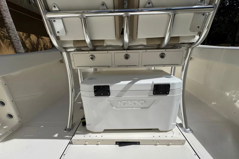 Slide: The Image of 2026 Bulls Bay 255CC boat interior with Igloo cooler and storage drawers. - 9
