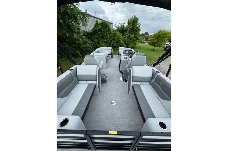 Slide: The Image of 2025 Veranda Vista Sport VS 22 RC pontoon boat interior with gray seating and green accents. - 4