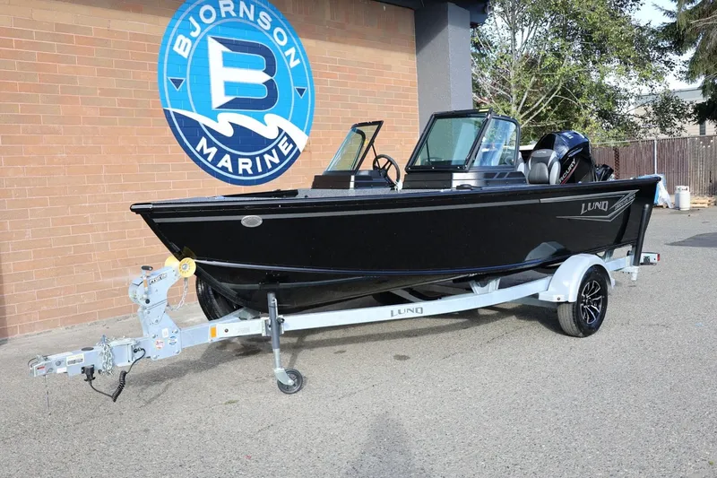 Slide: The Image of 2026 Lund 1800 Explorer Sport boat on trailer at Bjornson Marine. - 13