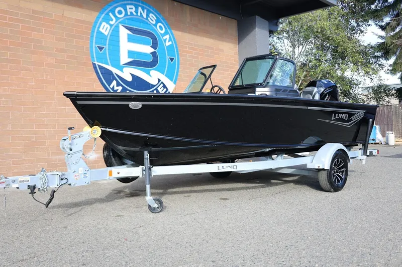 Slide: The Image of 2026 Lund 1800 Explorer Sport boat on trailer outside Bjornson Marine. - 14