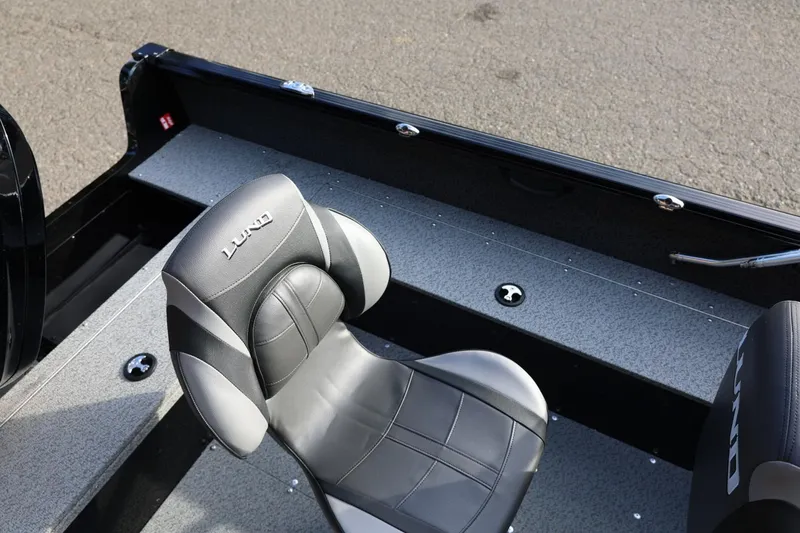 Slide: The Image of 2026 Lund 1800 Explorer Sport boat interior with sleek seating and durable flooring. - 18