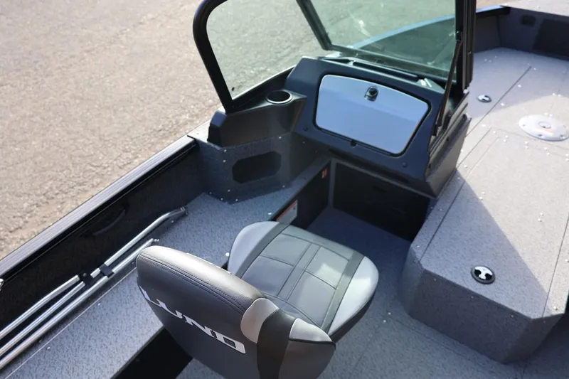 Slide: The Image of 2026 Lund 1800 Explorer Sport boat interior with seating and console. - 23