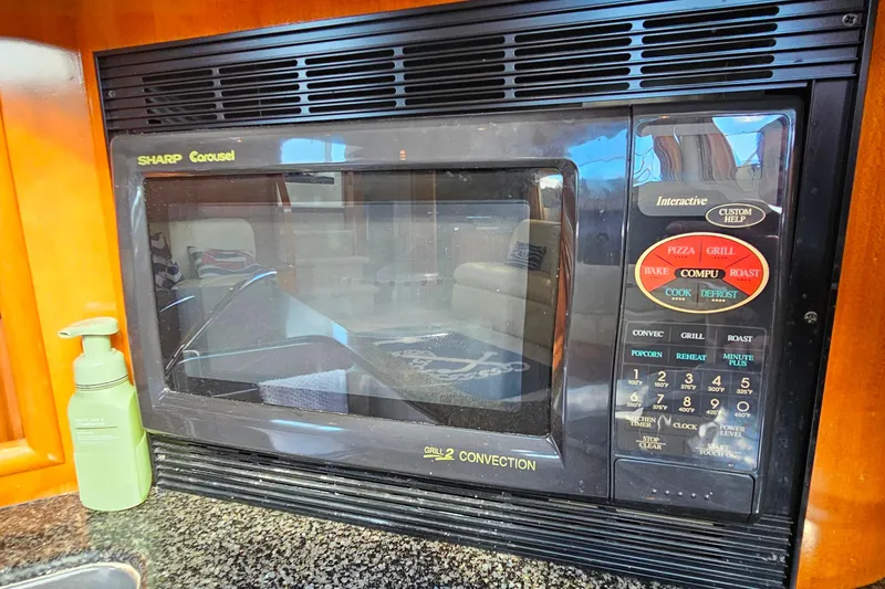 Slide: The Image of Sharp Carousel microwave in 2004 Carver 444 Cockpit Motor Yacht kitchen. - 34