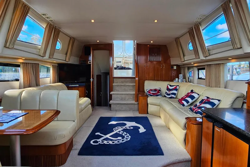 Slide: The Image of Luxurious interior of 2004 Carver 444 Cockpit Motor Yacht with elegant seating and nautical decor. - 35