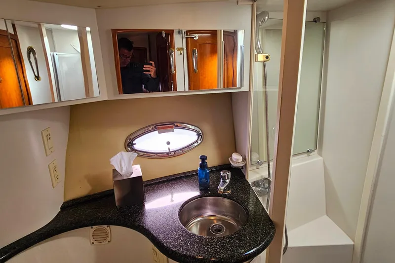 Slide: The Image of Bathroom interior of 2004 Carver 444 Cockpit Motor Yacht with sink and shower. - 42