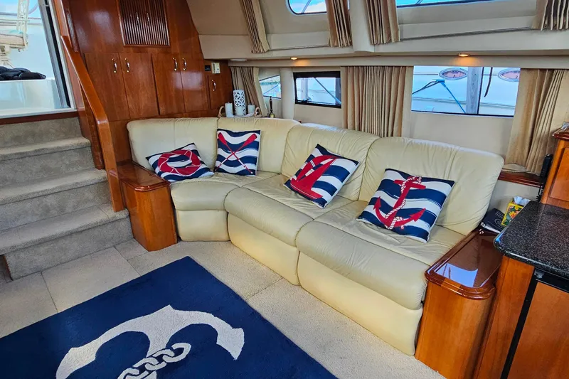Slide: The Image of Luxurious interior of 2004 Carver 444 Cockpit Motor Yacht with nautical-themed decor. - 38