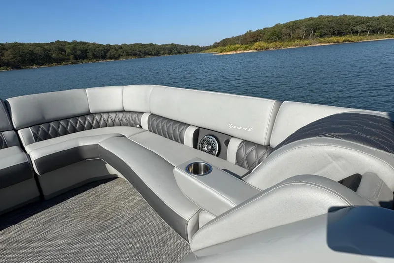 Slide: The Image of Luxurious seating on 2023 Bennington QX 27 QXSBAX2 pontoon boat, lake view. - 11
