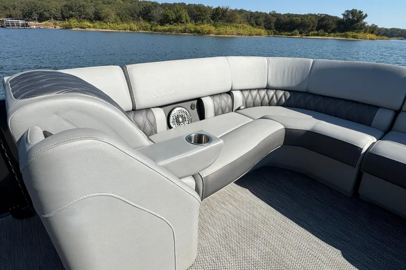 Slide: The Image of Luxurious seating on 2023 Bennington QX 27 QXSBAX2 pontoon boat, with scenic lake view. - 12