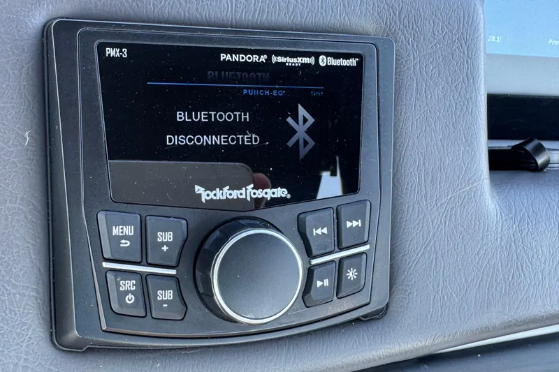 Slide: The Image of Rockford Fosgate PMX-3 audio system displaying "Bluetooth Disconnected" in a 2023 Bennington QX 27 QXSBAX2. - 21