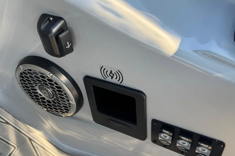 Slide: The Image of Control panel of 2023 Bennington QX 27 QXSBAX2 with speaker and switches. - 23