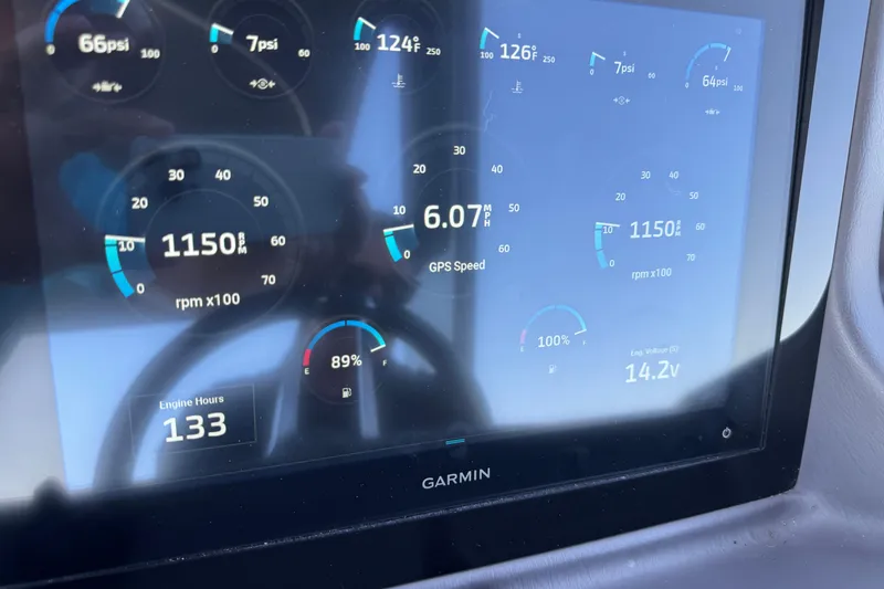 Slide: The Image of Garmin display on 2023 Bennington QX 27 QXSBAX2 showing engine metrics and GPS speed. - 30