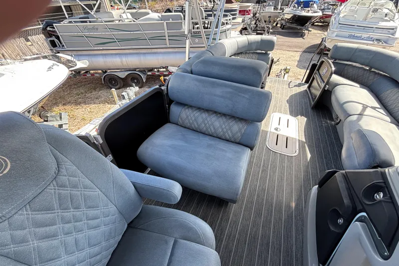 Slide: The Image of 2021 Premier 270 Intrigue RF pontoon boat interior with plush seating and modern design. - 13