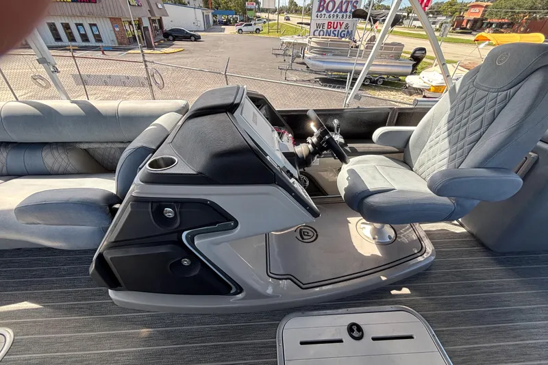 Slide: The Image of 2021 Premier 270 Intrigue RF boat interior with captain's chair and control console. - 17