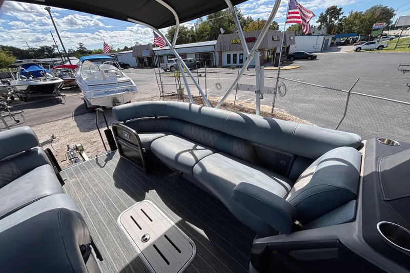 Slide: The Image of 2021 Premier 270 Intrigue RF pontoon boat interior with spacious seating and modern design. - 18